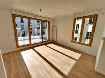 Béton, pierre massive, bois et béton de chanvre pour 15 logements neufs à Paris